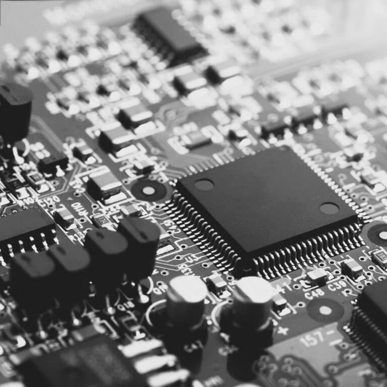 Closeup of electronic circuit board with CPU microchip electronic components background