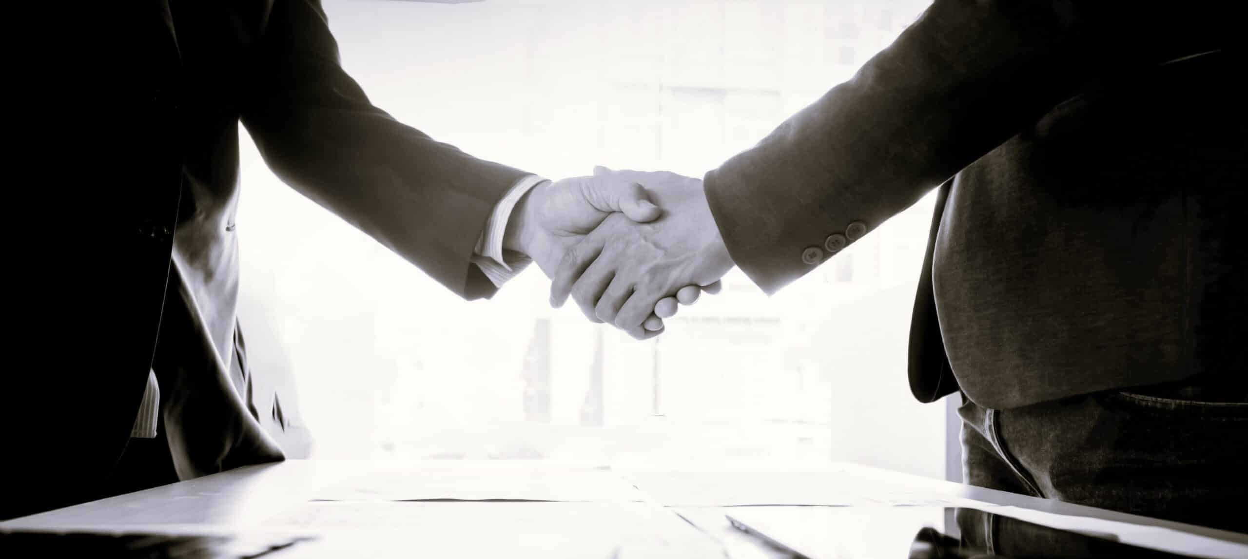Businessmen shaking hands during a meeting