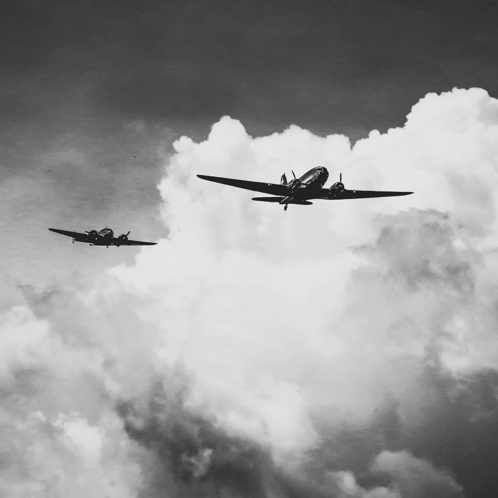 A low angle shot of a range of aircraft preparing an air show under the breathtaking cloudy sky