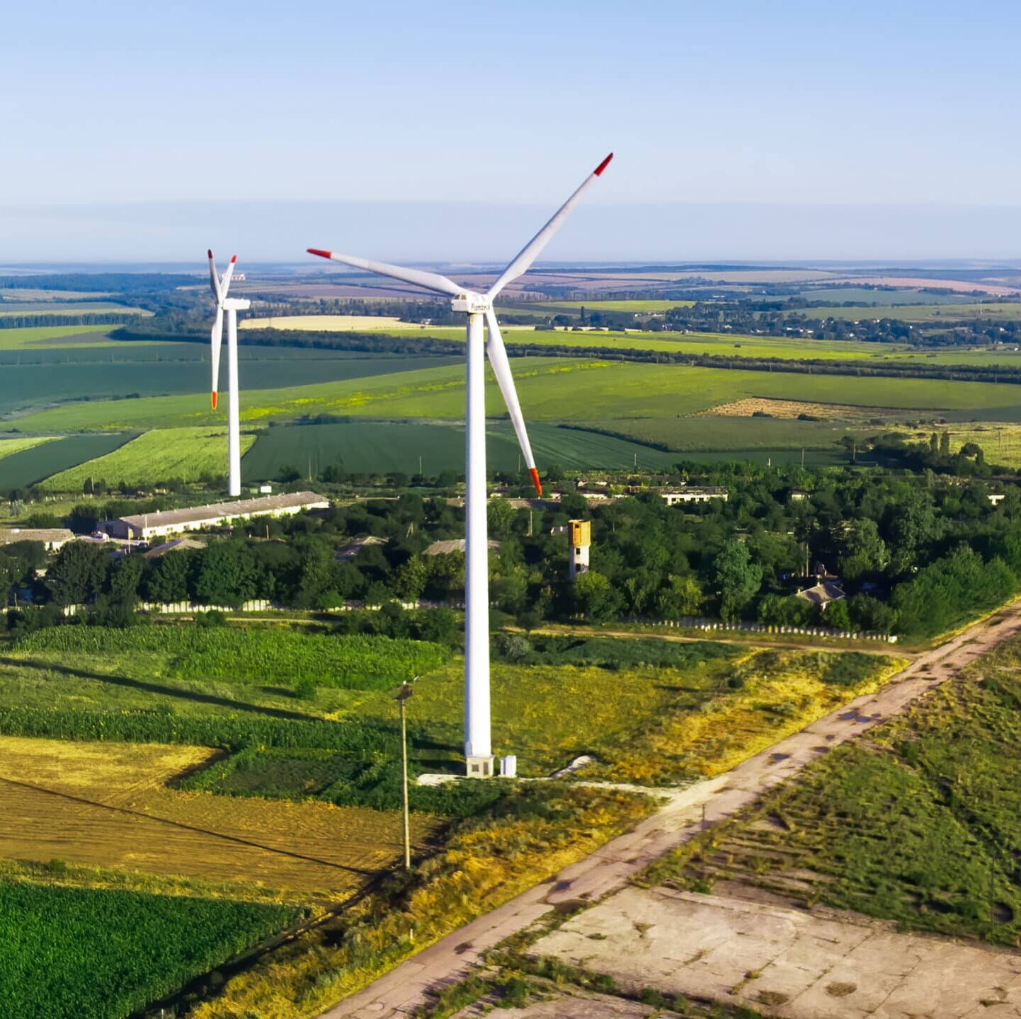 Three wind turbines located on a field near Donduseni, view from the drone in Moldova