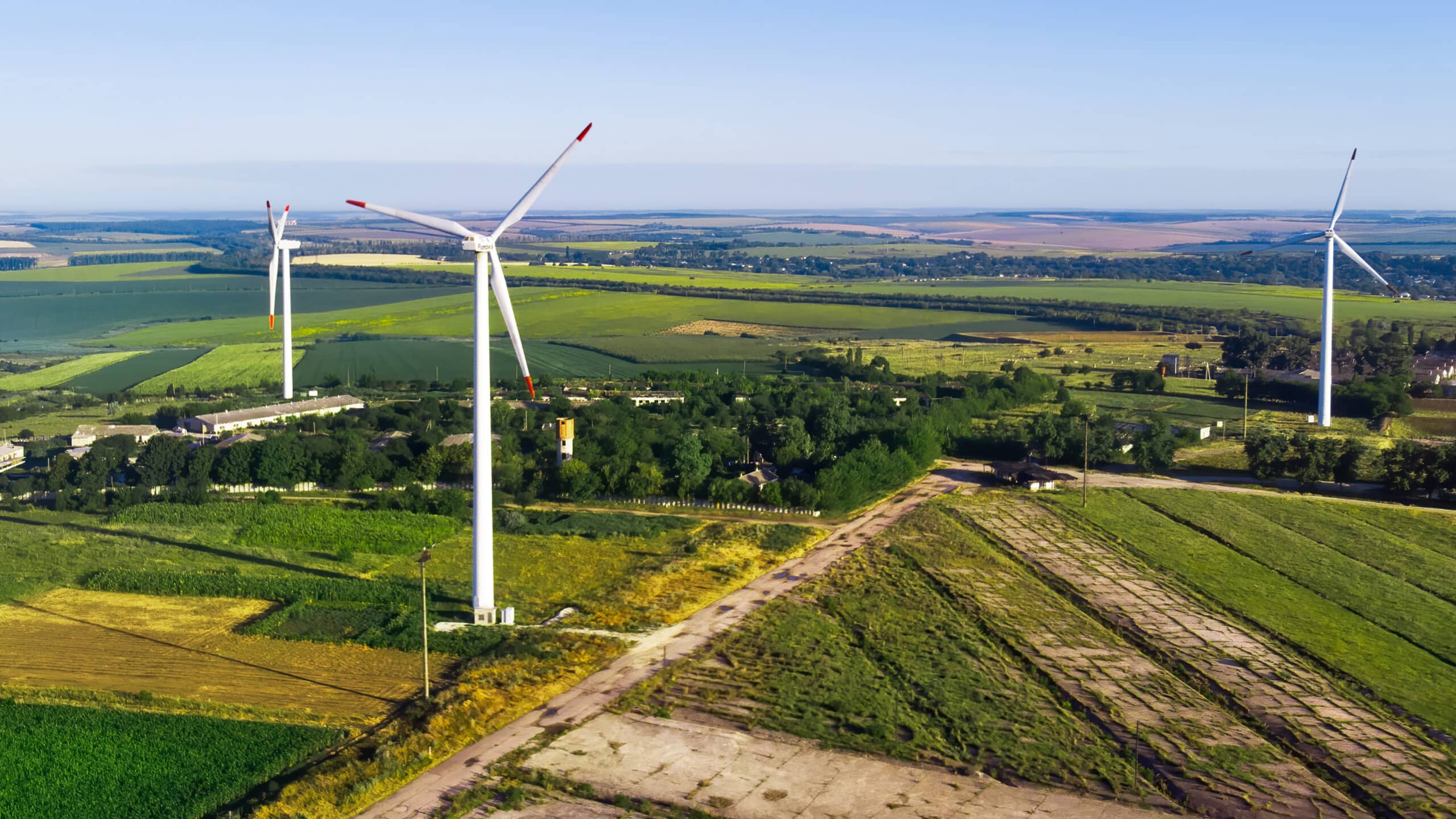 Three wind turbines located on a field near Donduseni, view from the drone in Moldova