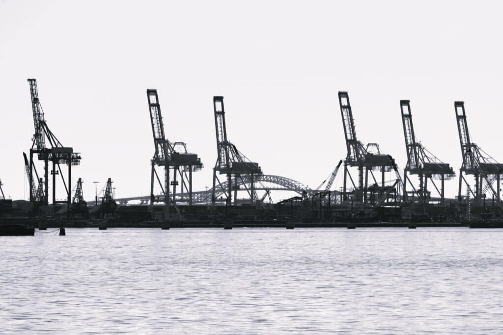 View of the seaport in New York at sunset, USA. Lots of cranes